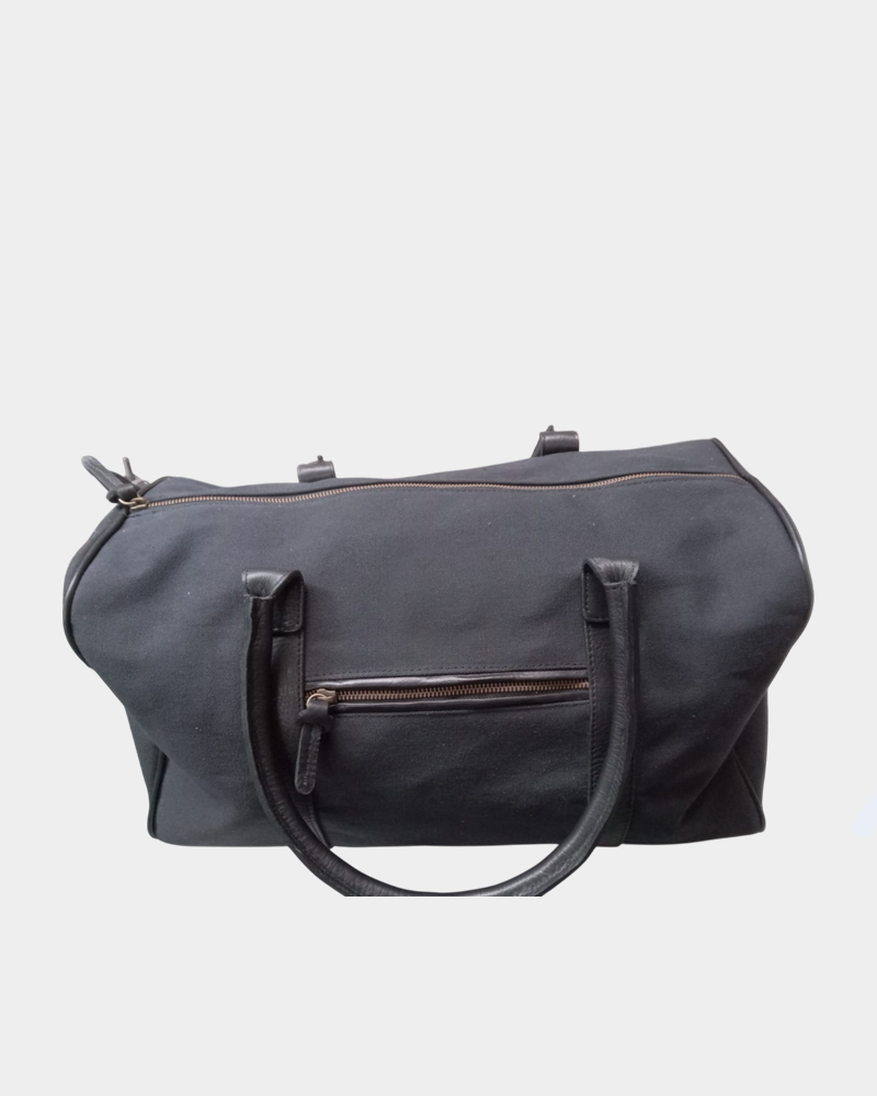 Bolso de lona azul detalle en cuero