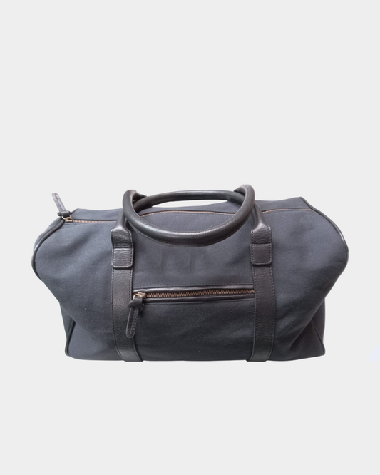 Bolso de lona azul detalle en cuero